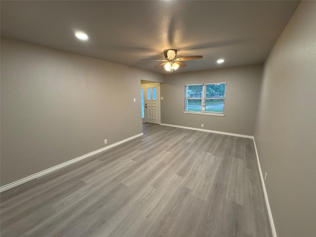 2401 N Alexander St, Sherman, TX 75092 - spare room with ceiling fan, baseboards, wood finished floors, and recessed lighting