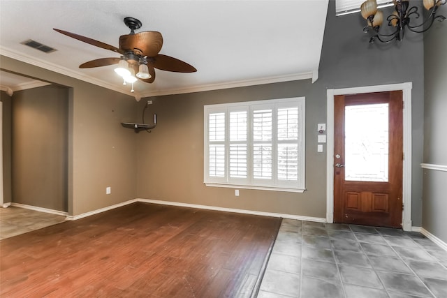 226 Miramar Dr, Arlington, TX 76002 - foyer entrance featuring a ceiling fan, a chandelier, crown molding, baseboards, and wood finished floors