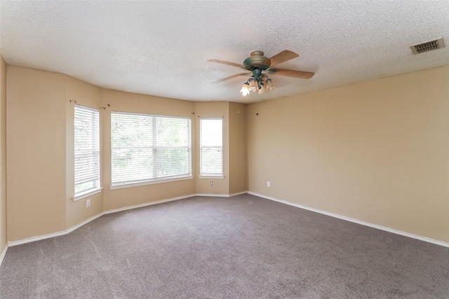 226 Miramar Dr, Arlington, TX 76002 - unfurnished room featuring ceiling fan, carpet floors, baseboards, and a textured ceiling