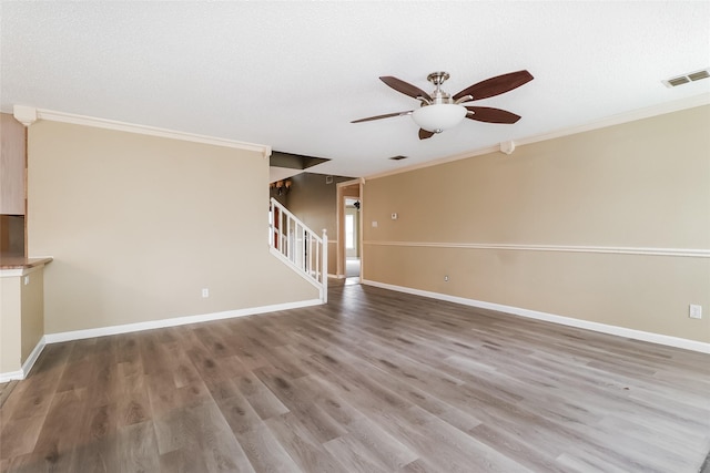 226 Miramar Dr, Arlington, TX 76002 - unfurnished living room with ceiling fan, ornamental molding, stairs, wood finished floors, and baseboards