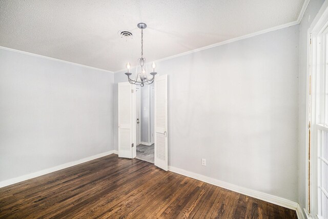 702 W Simmons St, Weatherford, TX 76086 - unfurnished room with a chandelier, dark wood finished floors, baseboards, and crown molding