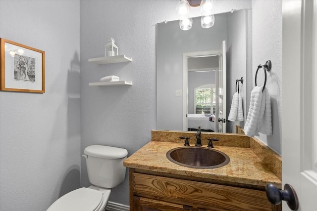 106 Versailles Ln, Aledo, TX 76008 - bathroom with vanity, toilet, connected bathroom, and a textured wall