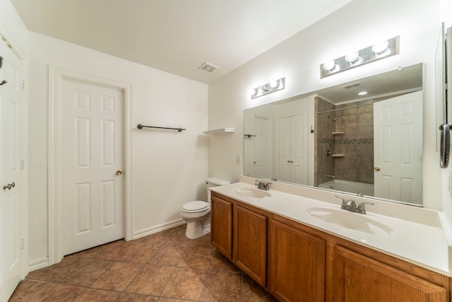 12916 Gillon Dr, Frisco, TX 75035 - bathroom with double vanity, toilet, bathing tub / shower combination, baseboards, and tile patterned floors