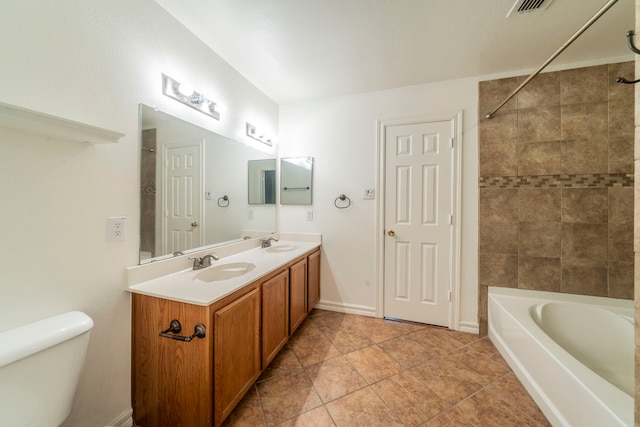 12916 Gillon Dr, Frisco, TX 75035 - bathroom with double vanity, toilet, bathtub / shower combination, and tile patterned flooring