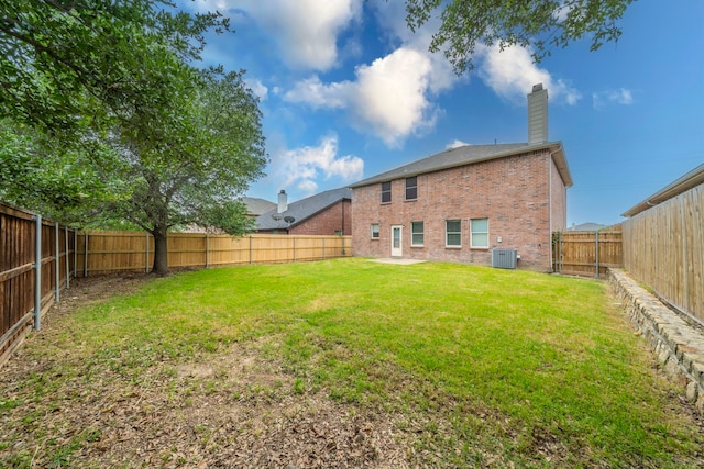 12916 Gillon Dr, Frisco, TX 75035 - rear view of property with brick siding, central AC, and a chimney