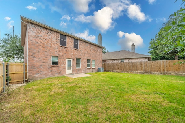 12916 Gillon Dr, Frisco, TX 75035 - rear view of house featuring brick siding, a chimney, central AC, and a patio area