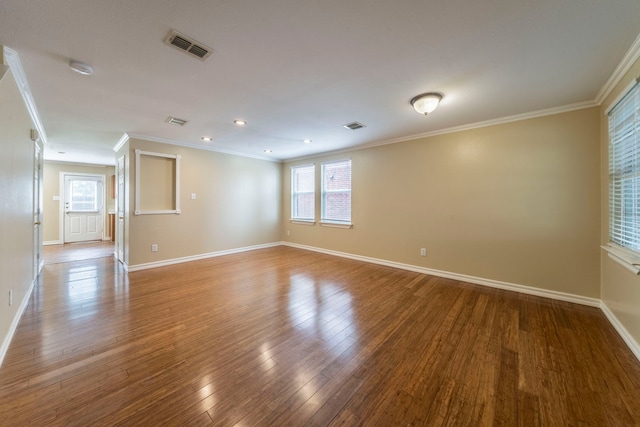 12916 Gillon Dr, Frisco, TX 75035 - empty room featuring crown molding, wood finished floors, baseboards, and recessed lighting