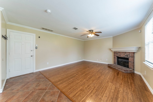 12916 Gillon Dr, Frisco, TX 75035 - unfurnished living room featuring ceiling fan, baseboards, a fireplace, and crown molding