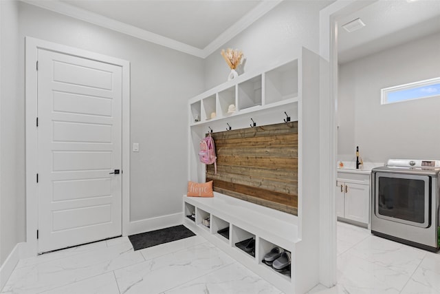 10901 Chriswood Dr, Crowley, TX 76036 - mudroom with washer / clothes dryer, crown molding, light marble finish floors, and baseboards
