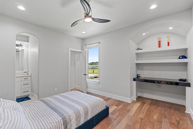 10901 Chriswood Dr, Crowley, TX 76036 - bedroom featuring arched walkways, light wood-type flooring, baseboards, recessed lighting, and a ceiling fan