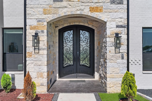 10901 Chriswood Dr, Crowley, TX 76036 - view of exterior entry with french doors and stone siding