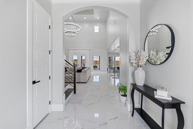 10901 Chriswood Dr, Crowley, TX 76036 - foyer with marble tiled flooring, baseboards, arched walkways, recessed lighting, and french doors