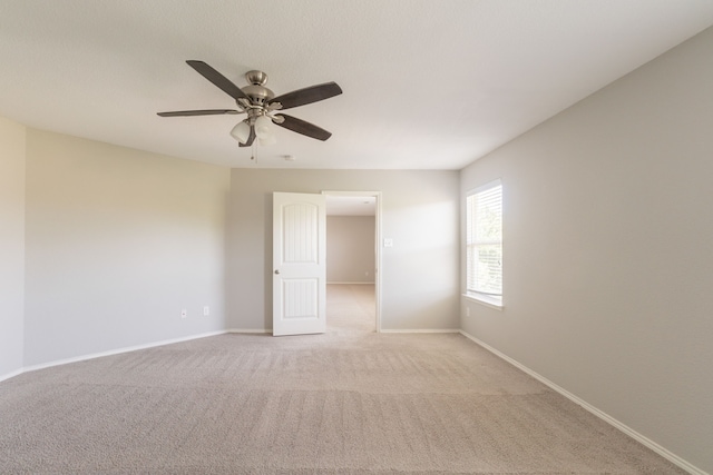 9233 Benevolent Ct, Providence Village, TX 76227 - unfurnished room featuring light carpet, a ceiling fan, and baseboards