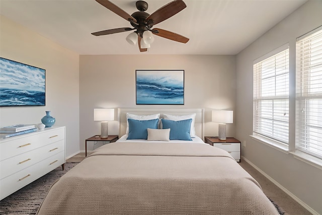9233 Benevolent Ct, Providence Village, TX 76227 - bedroom featuring carpet floors, baseboards, multiple windows, and a ceiling fan