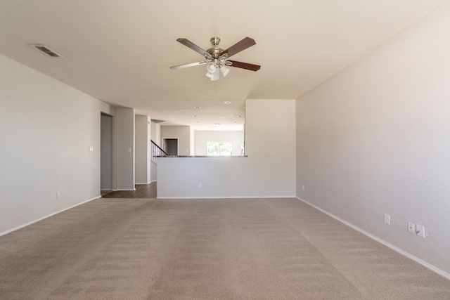 9233 Benevolent Ct, Providence Village, TX 76227 - unfurnished living room with light carpet, ceiling fan, and baseboards
