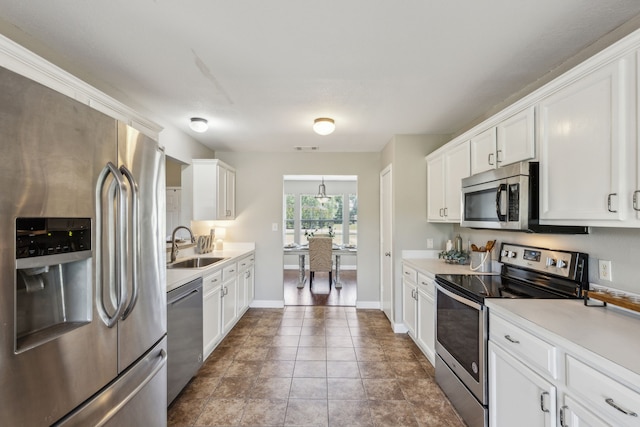830 Cross Timbers Dr, Lowry Crossing, TX 75069 - kitchen with stainless steel appliances, a sink, light countertops, and white cabinetry