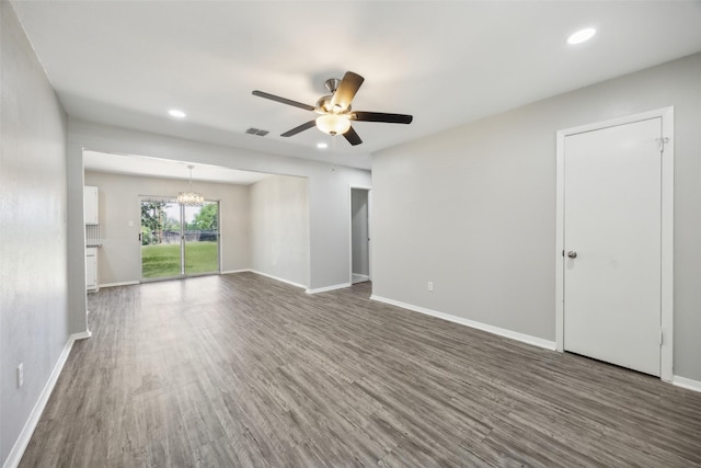 104 W Mistletoe Dr, Kennedale, TX 76060 - unfurnished living room featuring ceiling fan, a chandelier, recessed lighting, wood finished floors, and baseboards