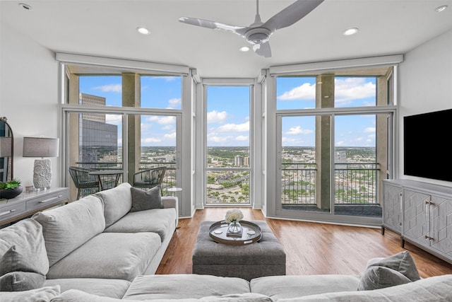 500 Throckmorton St Unit 2707, Fort Worth, TX 76102 - living area featuring a wall of windows, ceiling fan, wood finished floors, and recessed lighting