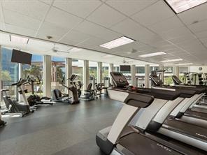 500 Throckmorton St Unit 2707, Fort Worth, TX 76102 - gym with a paneled ceiling and floor to ceiling windows