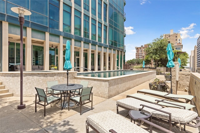 500 Throckmorton St Unit 2707, Fort Worth, TX 76102 - view of swimming pool featuring a patio and outdoor dining area