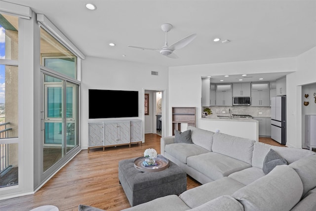 500 Throckmorton St Unit 2707, Fort Worth, TX 76102 - living area with a ceiling fan, light wood finished floors, and recessed lighting