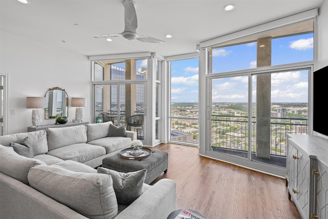 500 Throckmorton St Unit 2707, Fort Worth, TX 76102 - living room with a wall of windows, ceiling fan, recessed lighting, and wood finished floors