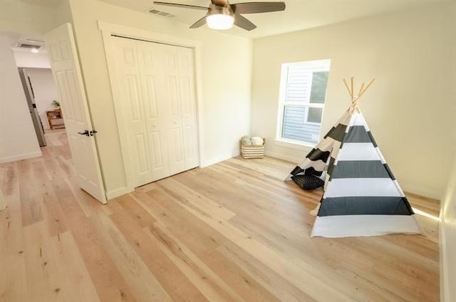 1917 E Mulberry St, Sherman, TX 75090 - playroom with wood finished floors, ceiling fan, and baseboards