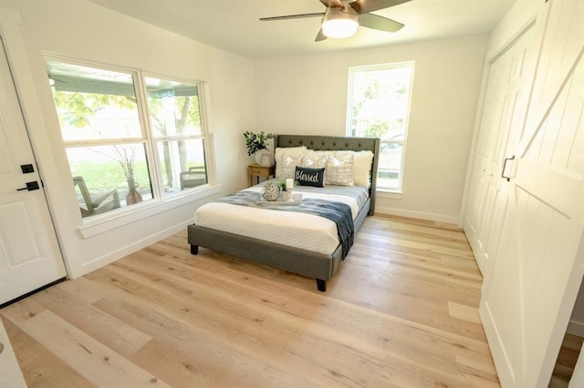 1917 E Mulberry St, Sherman, TX 75090 - bedroom featuring light wood-style floors, baseboards, and ceiling fan