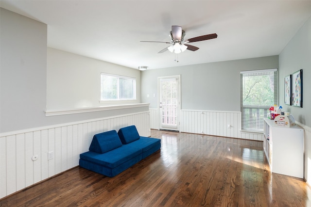 9030 Summer Glen Ln, Dallas, TX 75243 - unfurnished room with a wainscoted wall, healthy amount of natural light, wood finished floors, and ceiling fan