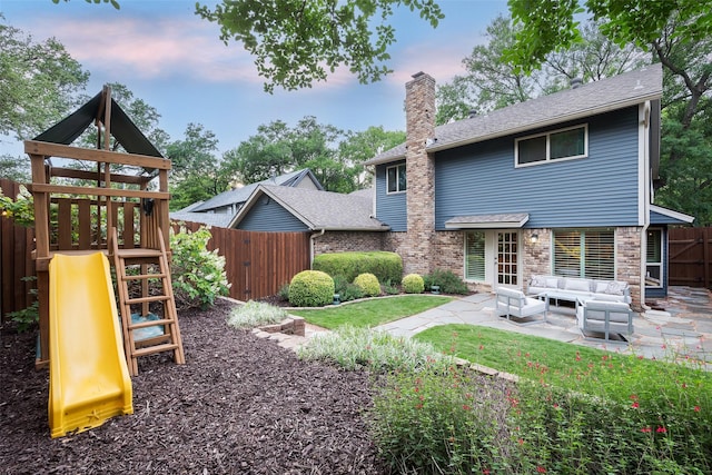 9030 Summer Glen Ln, Dallas, TX 75243 - rear view of property with a chimney, a playground, a fenced backyard, a patio area, and an outdoor hangout area