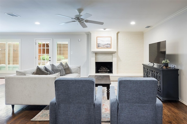 9030 Summer Glen Ln, Dallas, TX 75243 - living area with crown molding, a ceiling fan, dark wood-style flooring, a fireplace, and recessed lighting