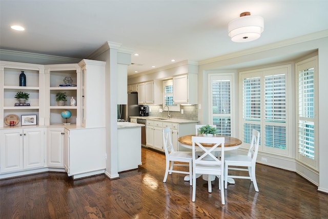 9030 Summer Glen Ln, Dallas, TX 75243 - kitchen featuring a sink, light countertops, open shelves, white cabinetry, and ornamental molding