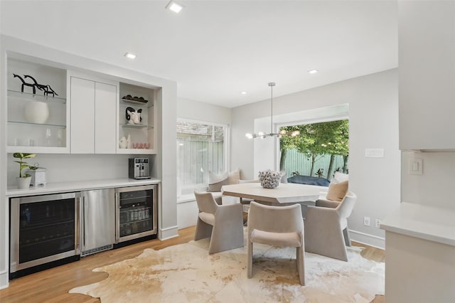 4356 San Carlos St, University Park, TX 75205 - dining space with beverage cooler, a dry bar, light wood-style flooring, and recessed lighting