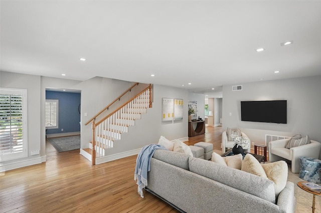 4356 San Carlos St, University Park, TX 75205 - living room featuring stairs, light wood-style flooring, baseboards, plenty of natural light, and recessed lighting