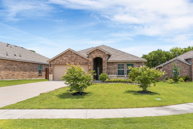 16316 Caledonia Ct, Justin, TX 76247 - view of front of property featuring an attached garage, concrete driveway, brick siding, and a front lawn