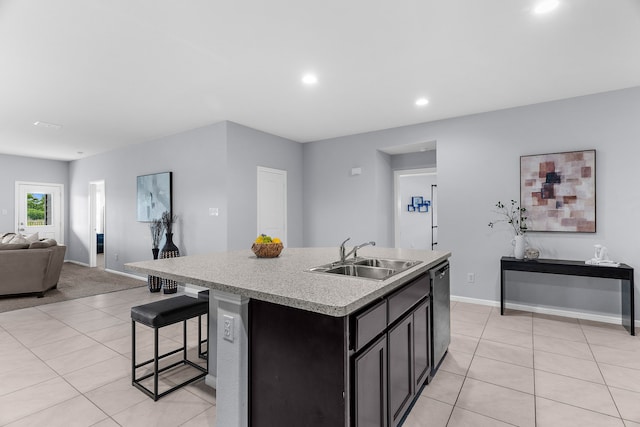16316 Caledonia Ct, Justin, TX 76247 - kitchen featuring a sink, open floor plan, light tile patterned flooring, a kitchen island with sink, and recessed lighting