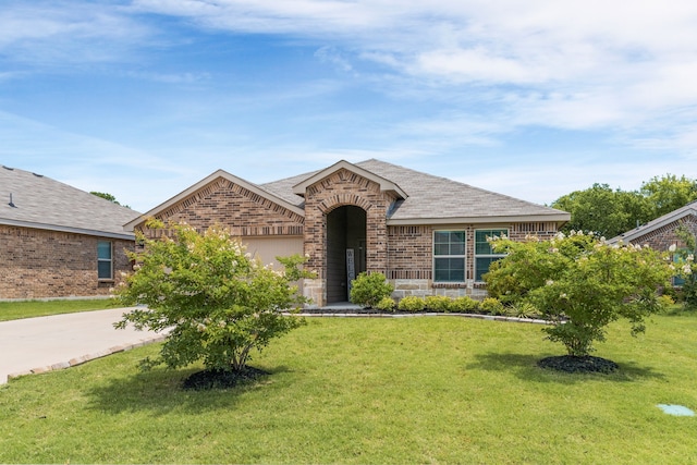 16316 Caledonia Ct, Justin, TX 76247 - view of front of property featuring brick siding, a front lawn, concrete driveway, and a garage