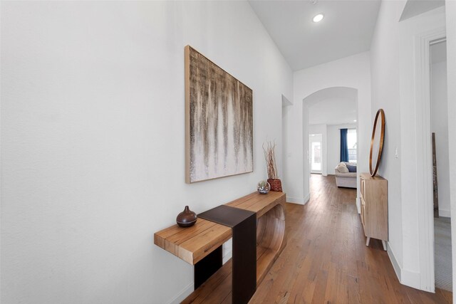 2020 Rhea Ct, Celina, TX 75009 - corridor with arched walkways, baseboards, and wood finished floors