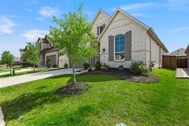 2020 Rhea Ct, Celina, TX 75009 - view of front facade with driveway, brick siding, and a garage
