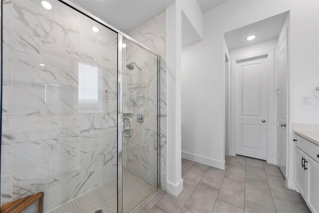 2020 Rhea Ct, Celina, TX 75009 - full bath with a marble finish shower, vanity, recessed lighting, baseboards, and tile patterned flooring