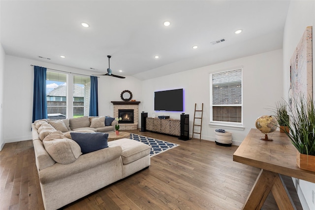 2020 Rhea Ct, Celina, TX 75009 - living area featuring ceiling fan, baseboards, wood finished floors, a brick fireplace, and recessed lighting