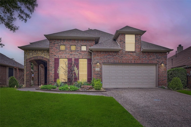 7341 Chadwick Dr, Mckinney, TX 75072 - french country style house featuring brick siding, a shingled roof, driveway, a lawn, and a garage