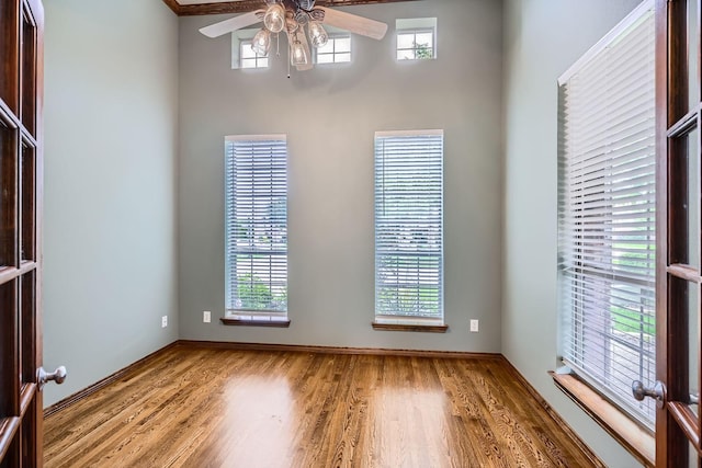 7341 Chadwick Dr, Mckinney, TX 75072 - unfurnished room featuring a ceiling fan, wood finished floors, and baseboards