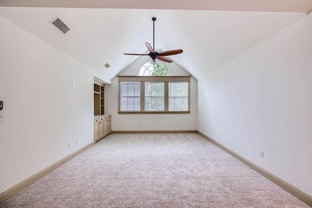 7341 Chadwick Dr, Mckinney, TX 75072 - empty room featuring light carpet, a ceiling fan, baseboards, and vaulted ceiling