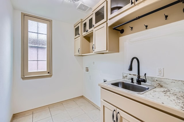 7341 Chadwick Dr, Mckinney, TX 75072 - laundry room with hookup for a washing machine, cabinet space, light tile patterned floors, and baseboards