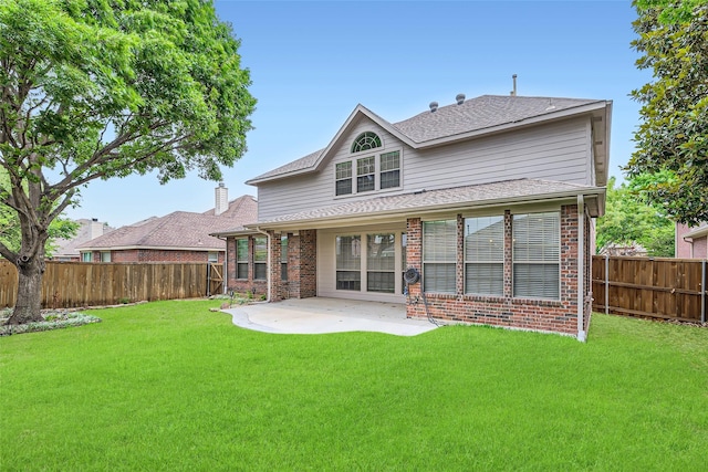 7341 Chadwick Dr, Mckinney, TX 75072 - back of house featuring brick siding, a patio area, and roof with shingles