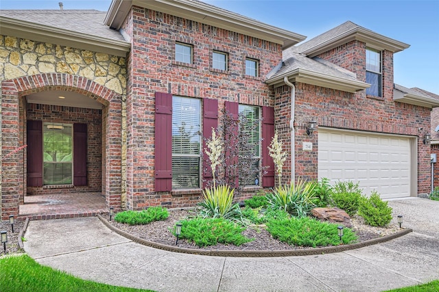 7341 Chadwick Dr, Mckinney, TX 75072 - view of front of home with brick siding, a shingled roof, driveway, and a garage