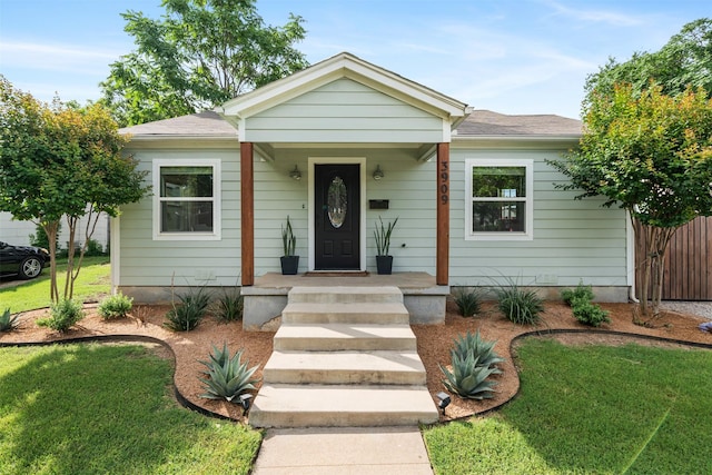 3909 Lisbon St, Fort Worth, TX 76107 - bungalow featuring a front lawn and a shingled roof