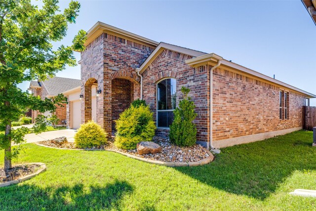 5212 Sugarcane Ln, Fort Worth, TX 76179 - view of front of home with brick siding, an attached garage, and concrete driveway