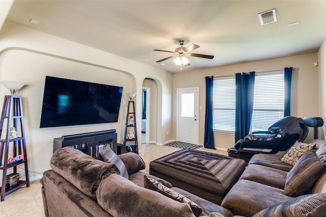 5212 Sugarcane Ln, Fort Worth, TX 76179 - living room with arched walkways, ceiling fan, and baseboards